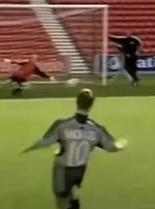 Michael Owen scoring a goal.