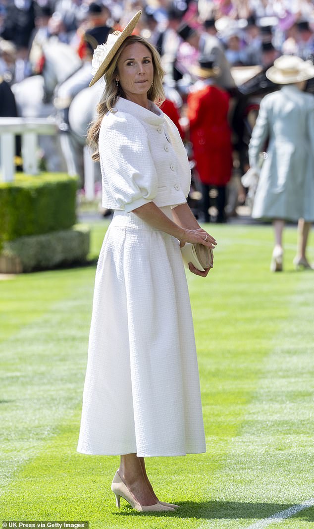 Harriet Sperling, 45, played the part perfectly in a Suzannah London ivory ensemble featuring a cropped jacket with puffed sleeves and matching skirt, costing £890 and £995 respectively