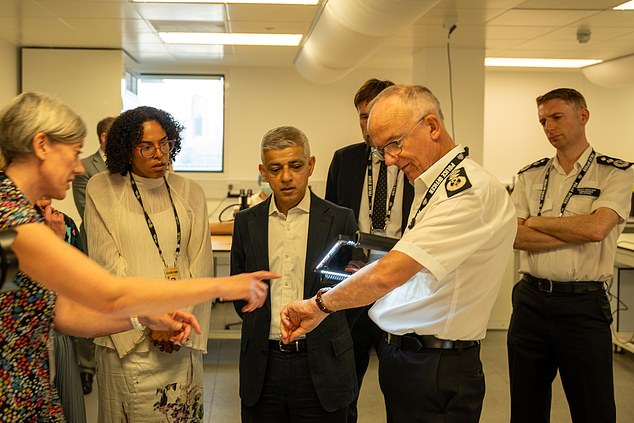 Metropolitan Police commissioner Sir Mark Rowley (second from right) demonstrating the device to London Mayor Sadiq Khan (centre)