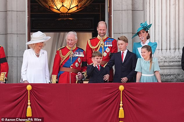 Ever the composed older brother, Prince George gently tried to calm Louis down by placing one hand on his arm as their father William, 40, looked affectionately down at his sons - while Princess Kate and Charlotte, 10, took in their surroundings