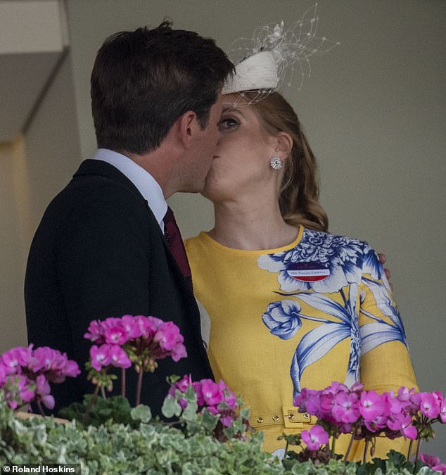 Love was in the air for Princess Beatrice and her husband Edoardo Mapelli Mozzi today as they shared a smooch in the royal box