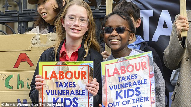 Private school families have been dealt a devastating blow after they lost a High Court challenge to Labour ’s VAT on fees (pictured: children protesting against the policy last month)