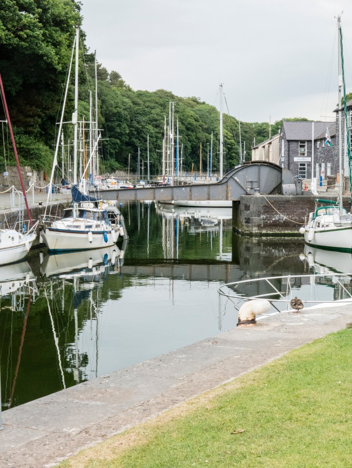 Sailboats in a marina on the Wales Coast Path.