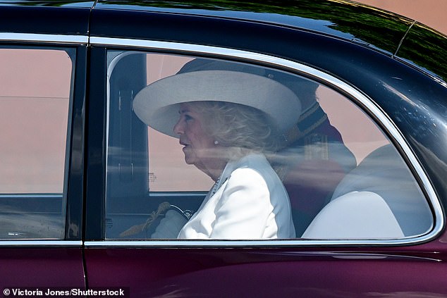The royal, 77, donned a white silk crepe dress with silver embroidery by Anna Valentine with a hat by Philip Treacy as she made her way for today's festivities