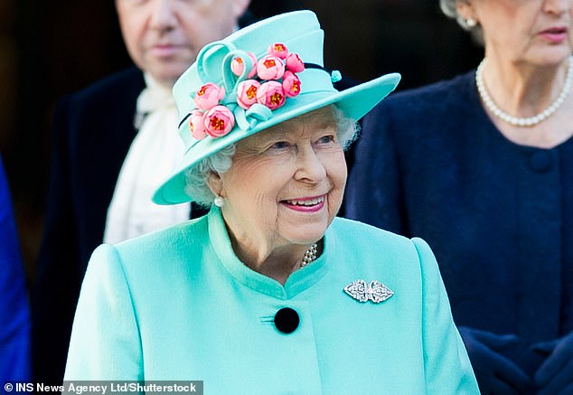 Queen Elizabeth II wears a charming peony hat by Rachel Trevor-Morgan in October 2018