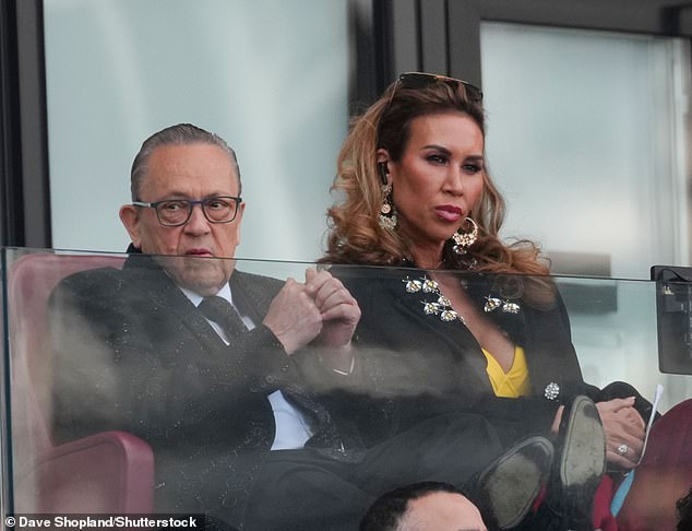 The mum-of-one, 43, fears that bosses with Housewives' parent company NBCUniversal will give her the chop after her 'name was dragged through the mud' (pictured with fiancé David Sullivan, 76)