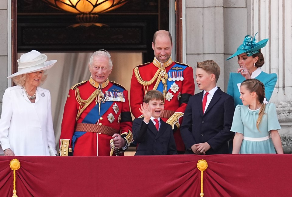 King Charles III, Queen Camilla, and their grandchildren on the Buckingham Palace balcony.