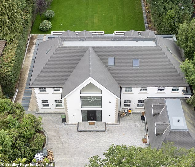 A planning row has erupted over a new property in Stoke Poges, Buckinghamshire, which local residents claim is in breach of planning rules and looks like a 'Los Angeles McMansion'