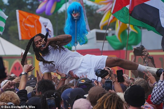 BBC boss Tim Davie faced mounting calls to quit last night as it emerged he was at Glastonbury on the day death chants against Jews were broadcast from the festival. Bobby Vylan (pictured) repeatedly chanted 'death, death to the IDF' during a performance at Glastonbury