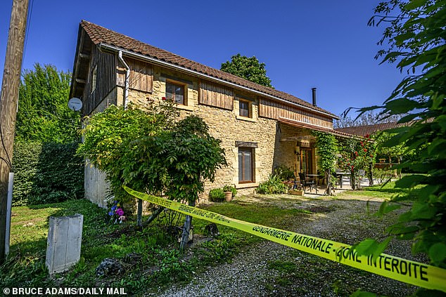 Police tape at the cottage where Karen Carter was stabbed eight times as she got out of her car