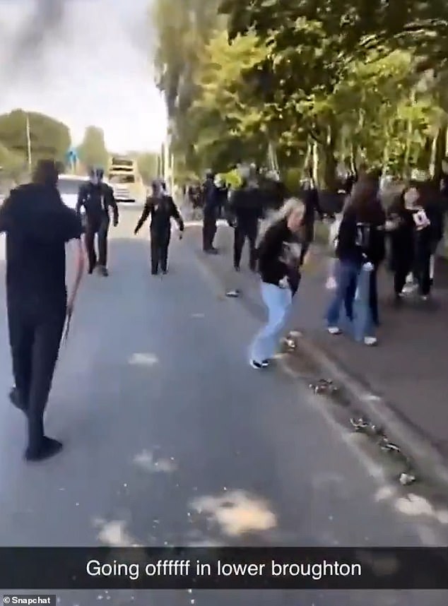 A crowd of people are filmed gathering on the streets today