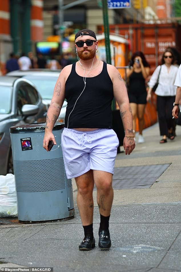Sam Smith put on a quirky display in purple shorts and loafers as they enjoyed a solo summer stroll through the streets of New York on Friday