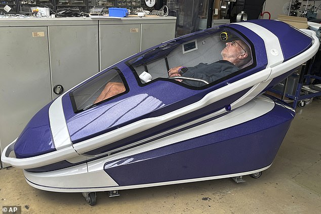 Dr Philip Nitschke, an Australian euthanasia activist dubbed 'Dr Death', inside the pod he invented