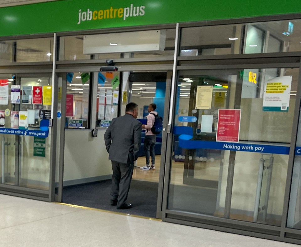 Man at Job Centre Plus entrance.