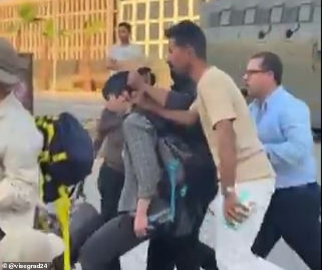 Footage shows authorities forcibly removing protesters from a sit-down demonstration at the Cairo border