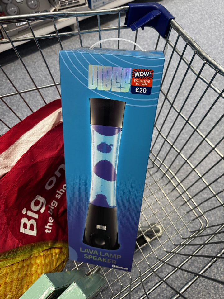 Lava lamp speaker in a shopping cart.