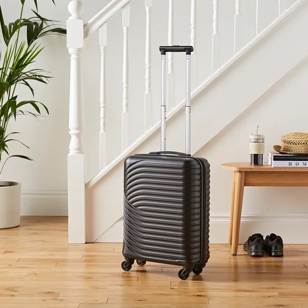 Black cabin suitcase with a textured surface.