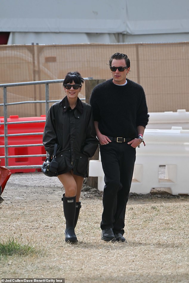 Lily Allen couldn't stop smiling as she stepped out with stylist Marco Capaldo for the second day in a row at Glastonbury on Saturday morning