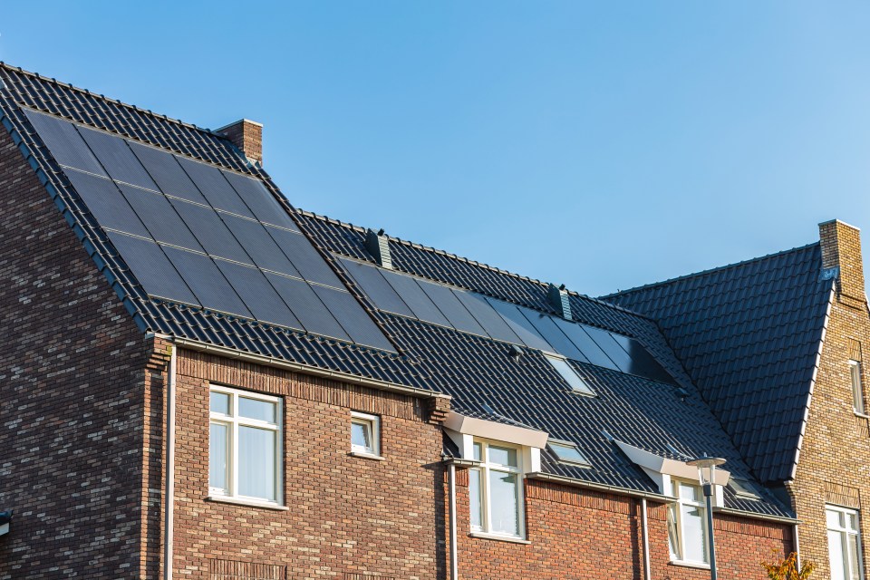 House with solar panels on its roof.