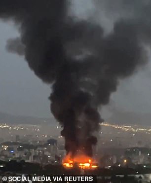 Smoke rises from a missile strike in Tehran