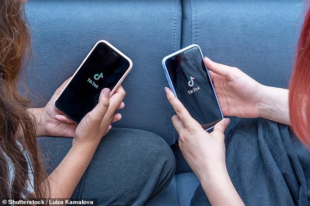 Students will spend 25 years glued to their phones if they don't change their screen habits, a study has found (stock image)