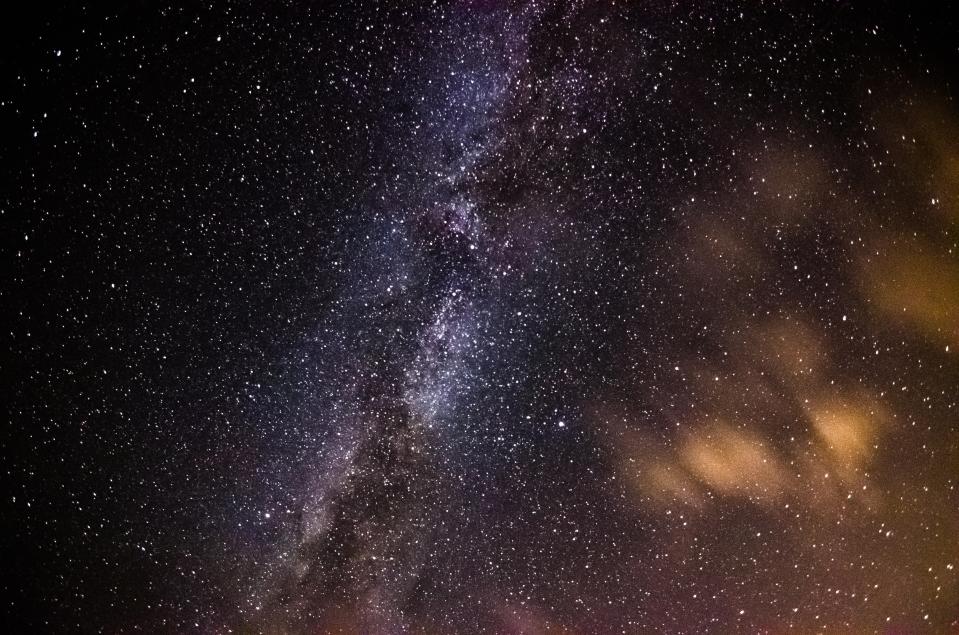 the milky way is visible in the night sky