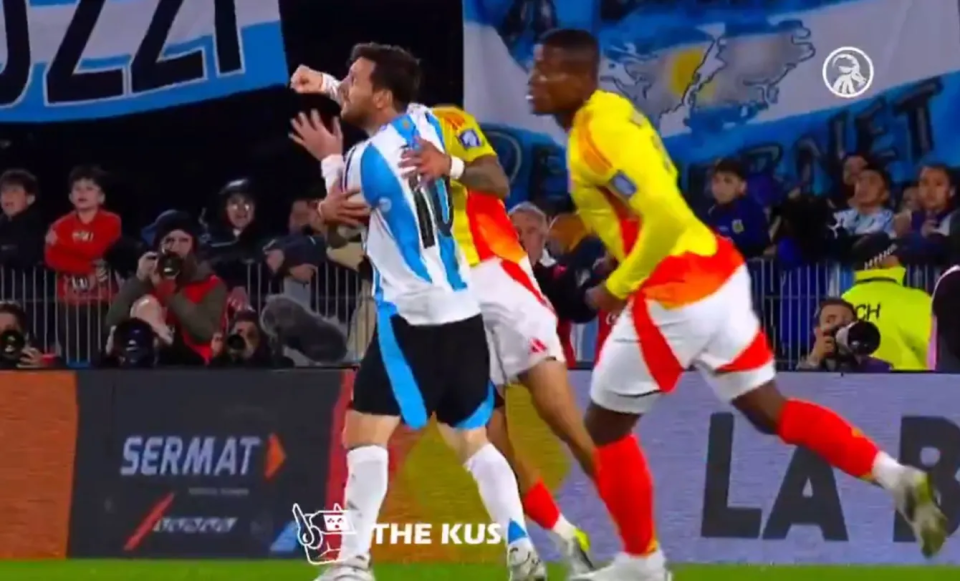 Soccer players celebrating a goal.