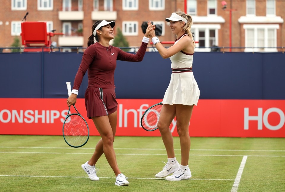 Emma Raducanu and Katie Boulter celebrating a point during a tennis match.