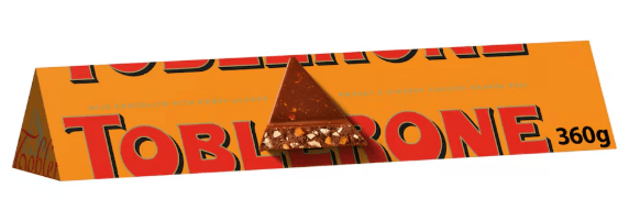 Toblerone 360g bar with a single piece on top.