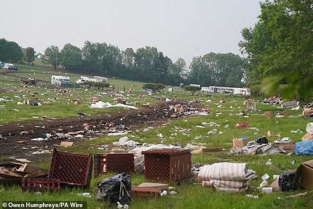 Thousands of pieces of litter are visible as well as plastic crates and cardboard boxes thrown across the site