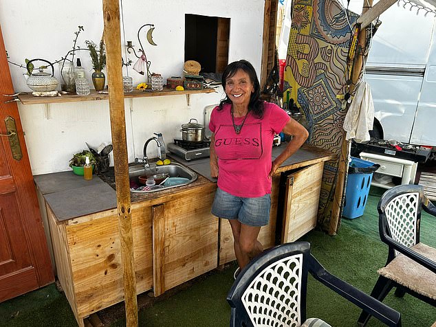 British mother-of-two Sharon (pictured), 63, lives in an encampment on a cascading hillside in Costa Adeje