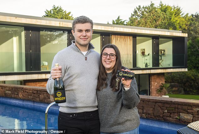 Omaze winners Lauren Keene and Ryan Mitchell outside their home on the Wirral, which they won in the prize drawn in December