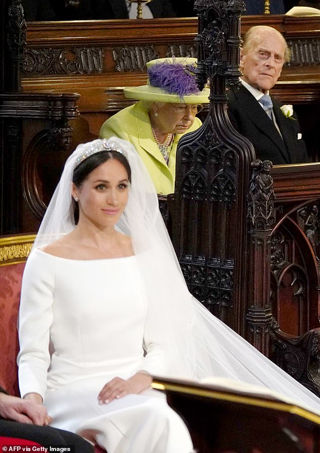 Prince Philip watches Meghan Markle during her wedding to Prince Harry in 2018. Philip was reportedly left 'very disappointed' in Meghan for not following his example