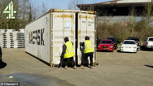 Investigators open up a shipping container at Felixstowe amid suspicions stolen cars are inside