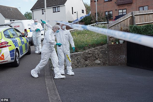 Forensic officers at the McCullough's property while it was being searched