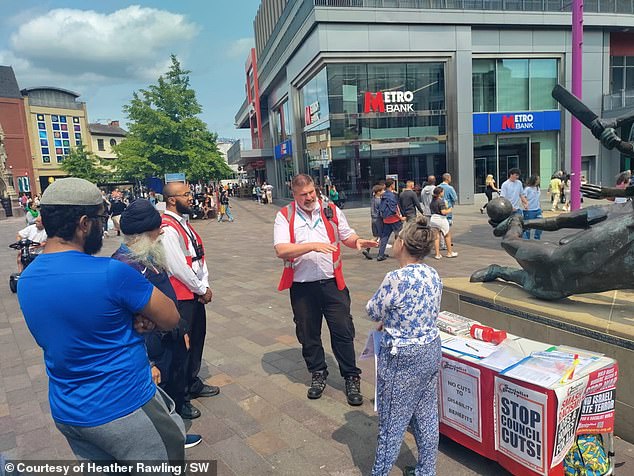 A grandmother campaigning against council cuts was fined because a camping table she set up on the street was judged to be an 'unauthorised structure'