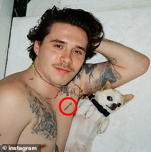 Brooklyn unveiled the 'mama's boy' inkwork (seen on his chest) in 2019 after first visiting a tattoo studio in 2017