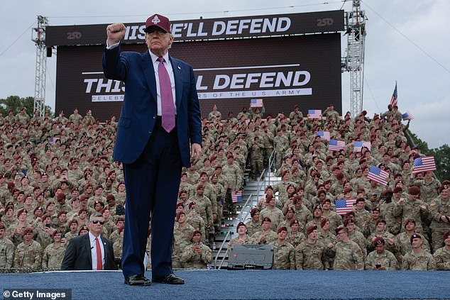 U.S. President Donald Trump pumps his fist as he leaves the stage during a rally with U.S. Army troops on June 10, 2025 at Fort Bragg, North Carolina