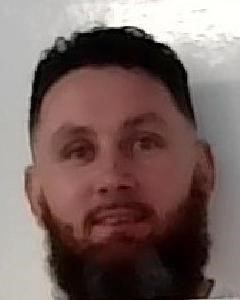 Mugshot of Jason MacDonagh, a prison absconder.
