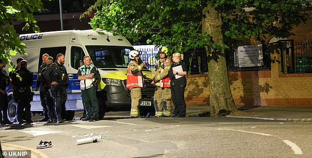 Officers and paramedics swarmed the scene on Station Parade outside Willesden Green Underground Station