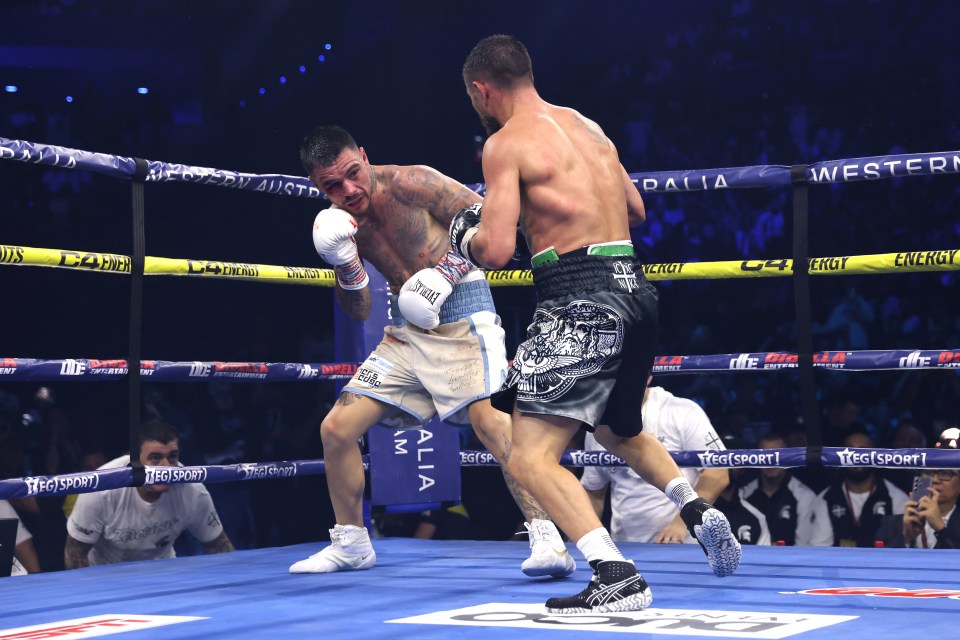 Boxers George Kambosos Jr. and Vasiliy Lomachenko in a boxing match.