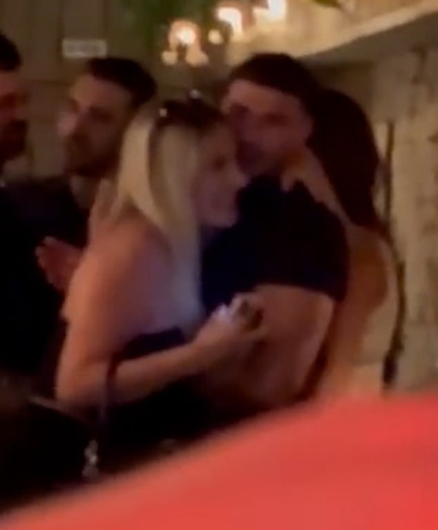 Tommy Fury shared a hug with his brother Roman's girlfriend, who strikes a remarkable resemblance to his own partner Molly-Mae Hague, during a wild night out on Friday
