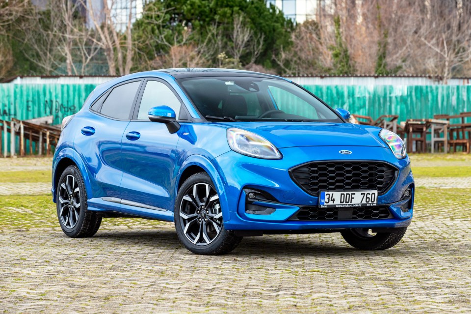 Blue Ford Puma subcompact crossover SUV.