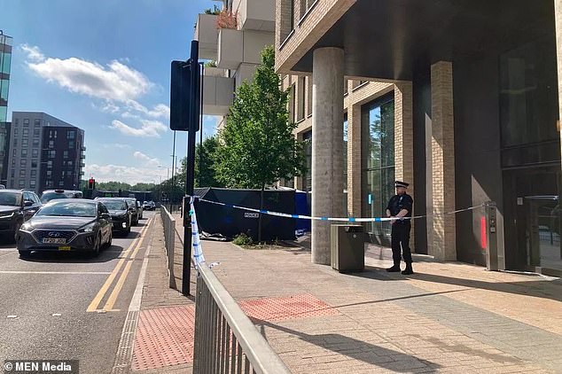 Police tape remains in place as the force investigates after being called to Great Ancoats Street in Manchester at around 7am today following reports a body had been found