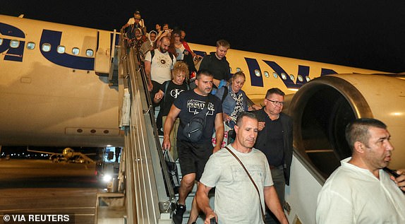 People evacuated from Israel disembark from a plane, amid the Israel-Iran conflict, at Vasil Levski Sofia airport, Sofia, Bulgaria, June 18, 2025. Bulgarian Foreign Ministry/Handout via REUTERS ATTENTION EDITORS - THIS IMAGE HAS BEEN SUPPLIED BY A THIRD PARTY. NO RESALES. NO ARCHIVES