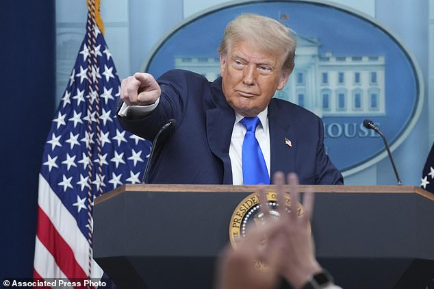 President Donald Trump points to a reporter to take a question as he speaks to the media, Friday, June 27, 2025, in the briefing room of the White House in Washington