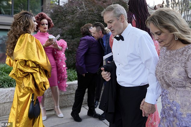 Trump ally, GOP Rep. Jim Jordan (center right) and his wife Polly (right) walk past drag queens (from left) Tara Hoot, Ricky Rosa, Vagenesis and Maria Con Carne who were gathered outside the Kennedy Center as President Donald Trump's motorcade rolled by