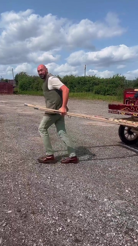 Tyson Fury pulling a horse-drawn cart.