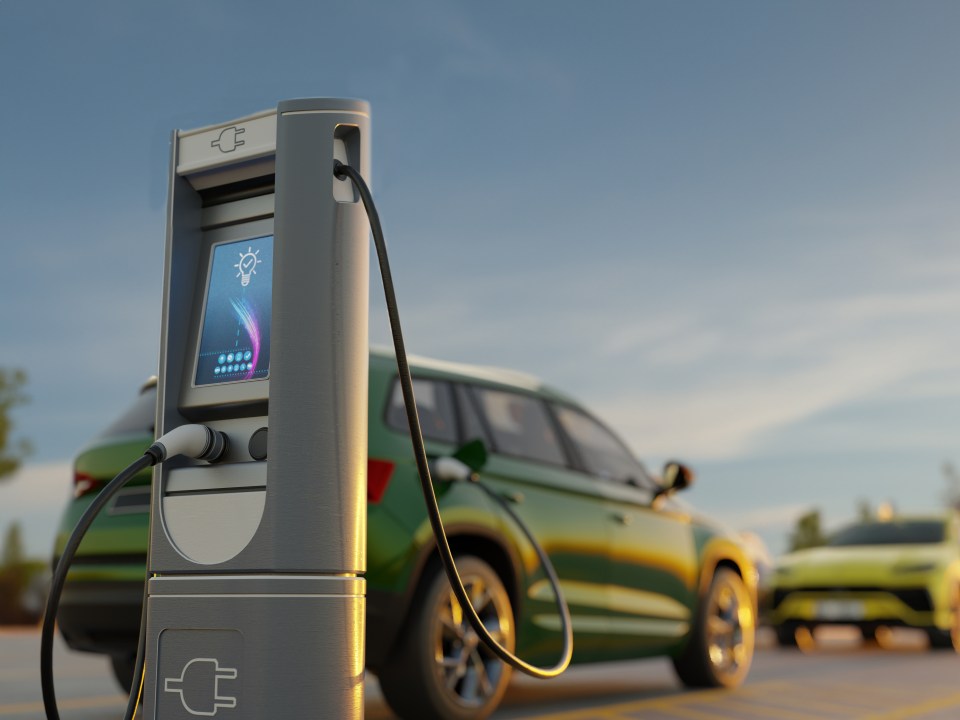 Electric car charging at a modern charging station.