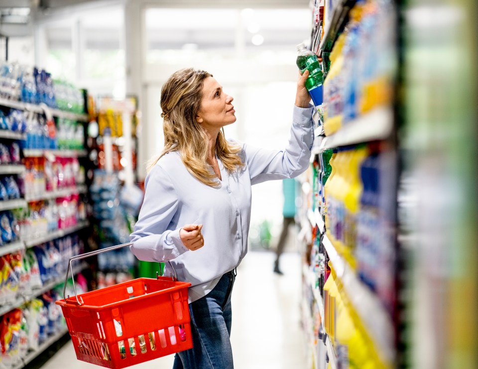 Woman shopping for groceries in a supermarket.
